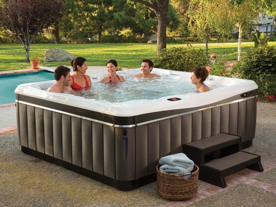 Family enjoying Caldera hot tub spa