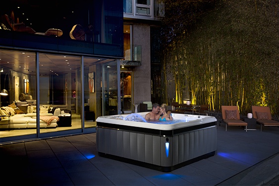 an image of a Caldera Utopia Tahitian best hot tub on a beautiful backyard patio with low maintenance and best price