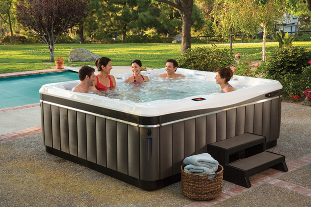 Family enjoying Caldera hot tub spa