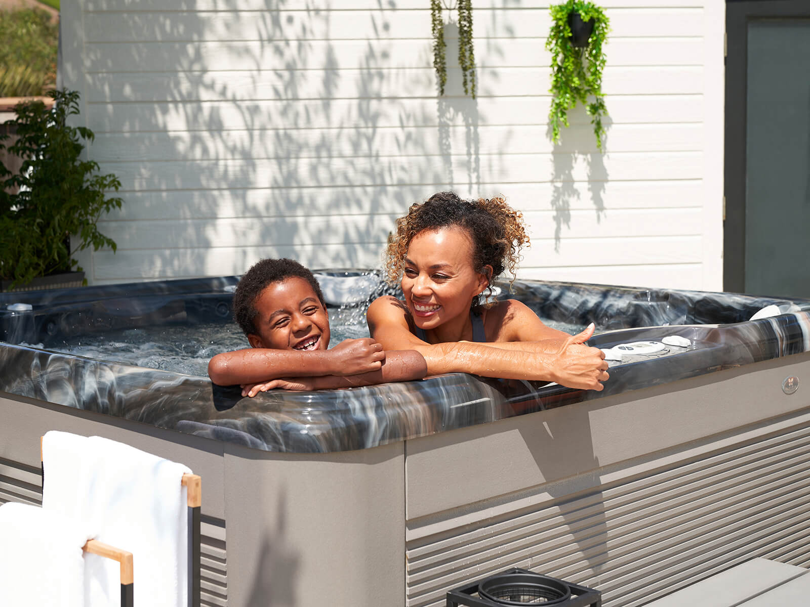 Caldera Spas woman with child in spa