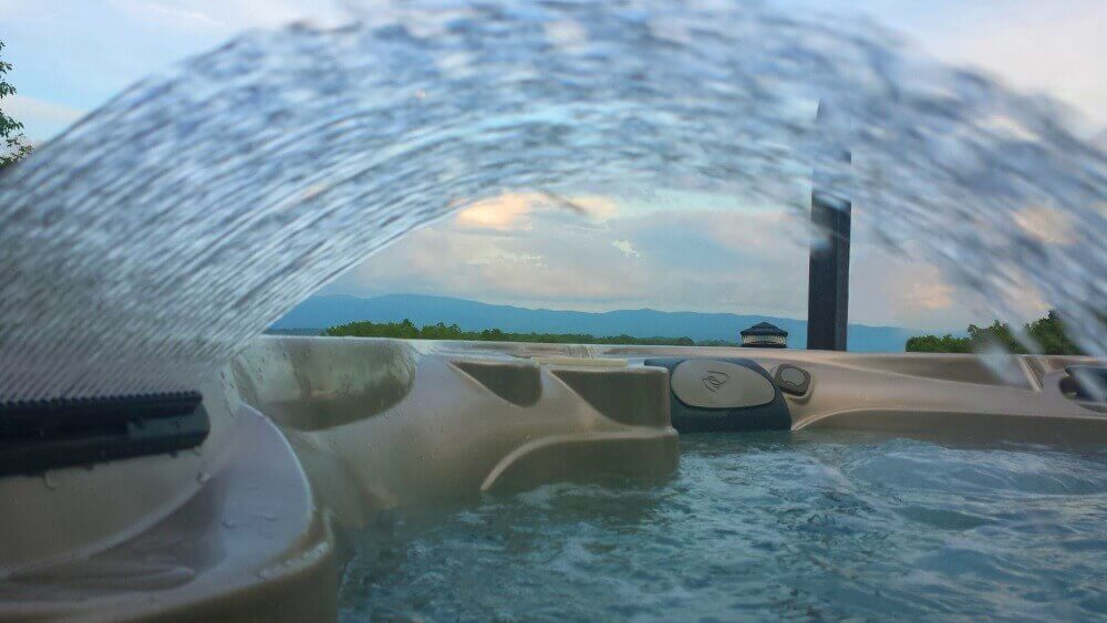 Caldera Hot Tub waterfall and a view